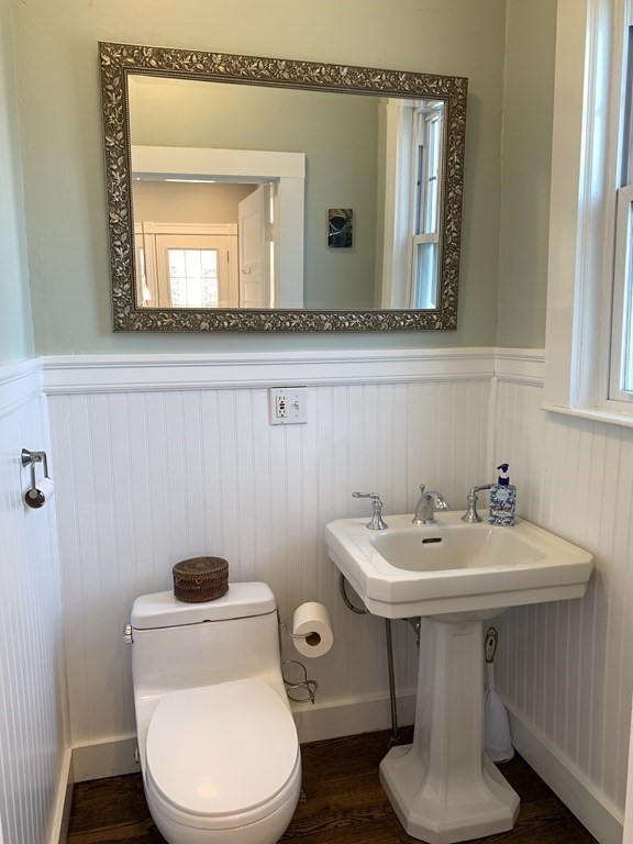 93 Waldeck Road Milton, MA 02186 - Photo 21 of 30 a bathroom with a toilet a sink and mirror