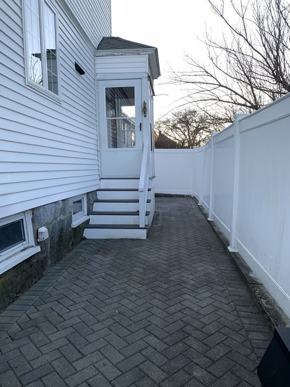 93 Waldeck Road Milton, MA 02186 - Photo 24 of 30 a view of a house with a yard