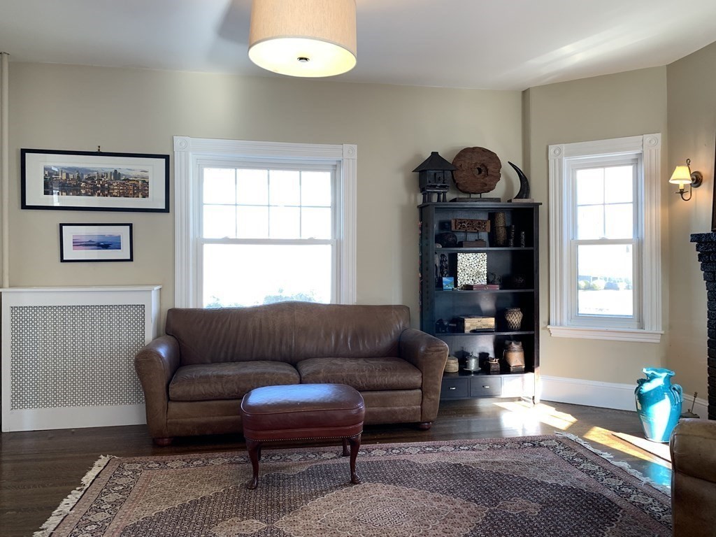 93 Waldeck Road Milton, MA 02186 - Photo 10 of 30 a living room with furniture and a window