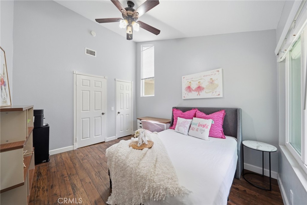 259 Scenic Way Brea, CA 92821 - Photo 37 of 62 a bedroom with a large bed and a chandelier