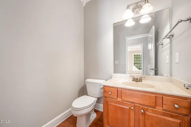 a balcony with wooden floor and fence