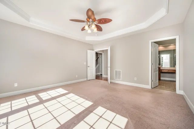 an empty room with a cabinet and a bathroom