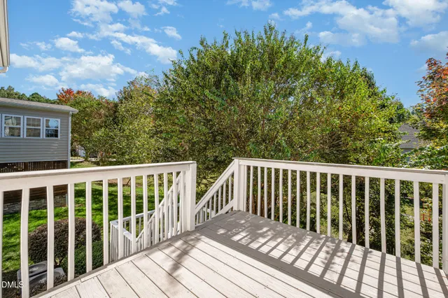 a room with pool table and windows