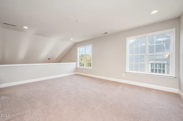 a living room with furniture and ceiling fan