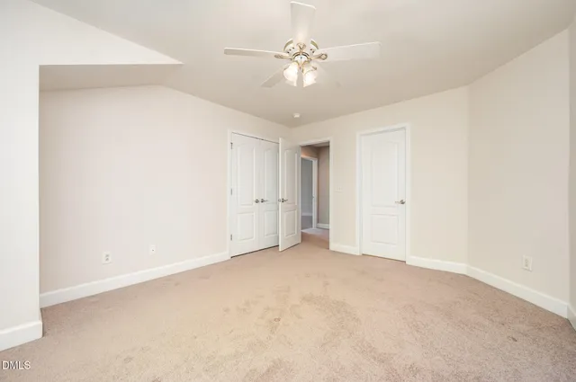 a view of a chair and table in front of house