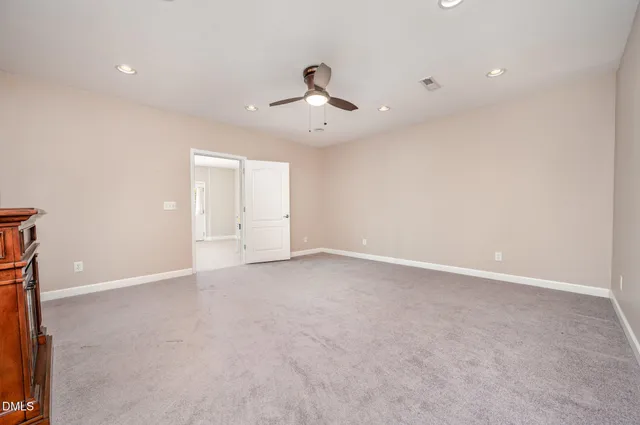 an aerial view of a house with swimming pool and furniture