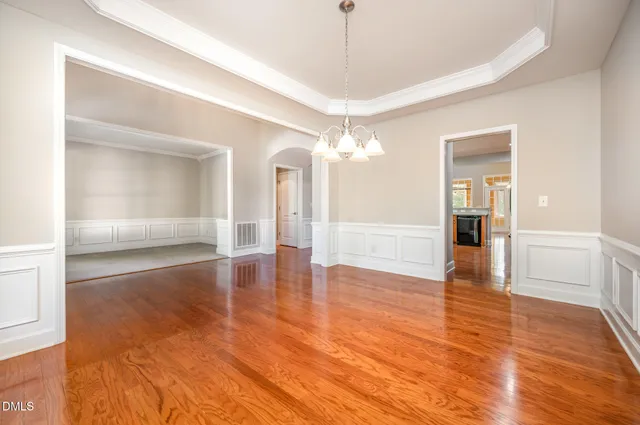 a view of a room with window and wooden floor