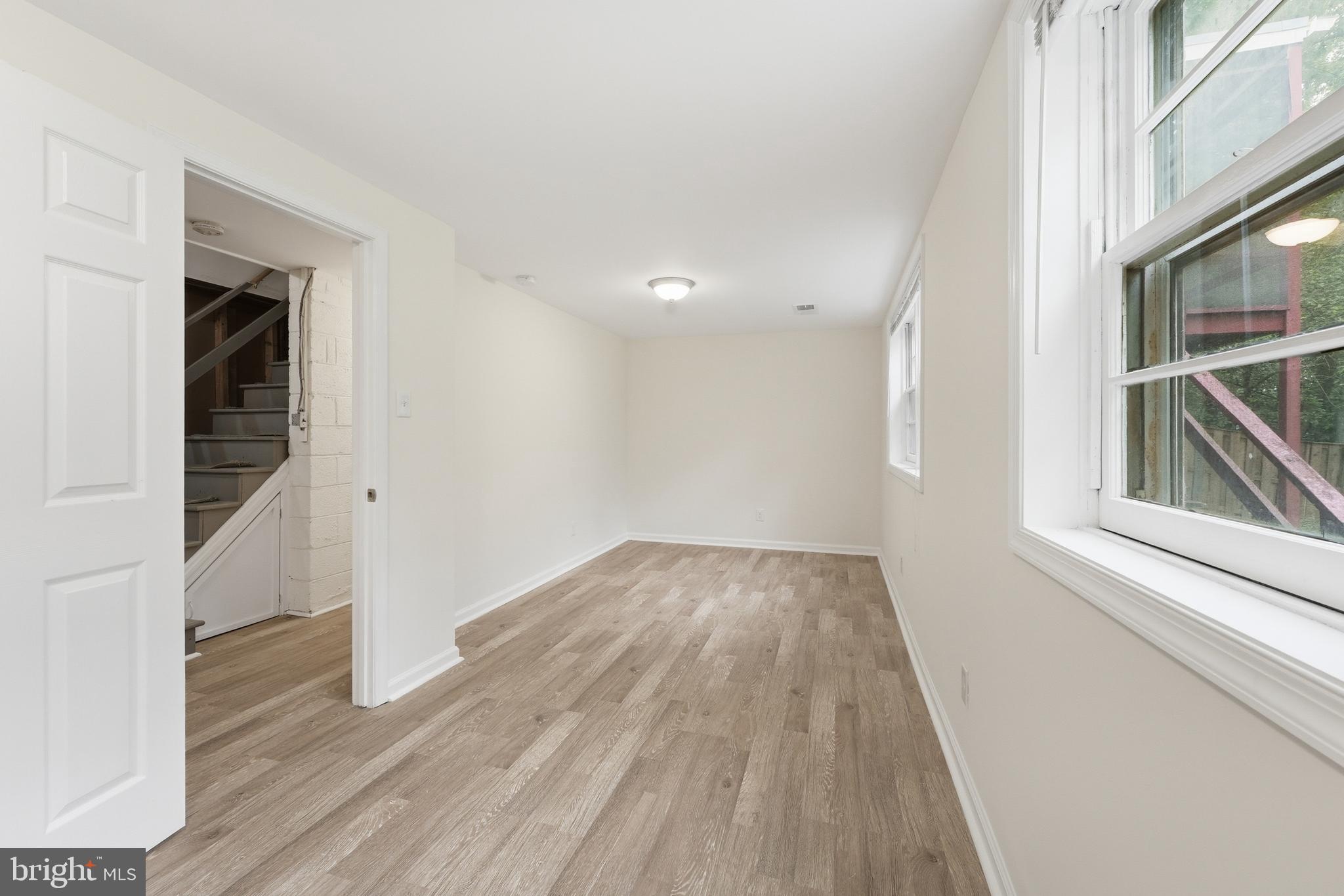 228 Northwest Terrace Silver Spring, MD 20901 - Photo 46 of 70 wooden floor in an empty room with a window