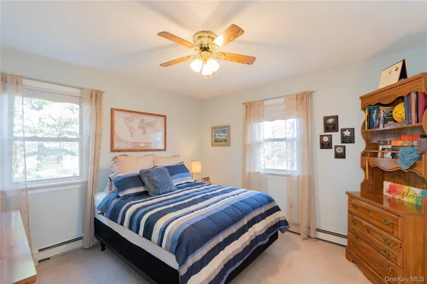 a bathroom with a shower a sink and a mirror