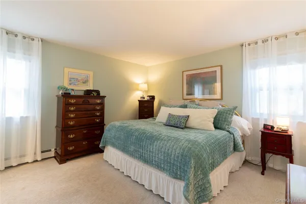 a dining room with furniture a window and a chandelier