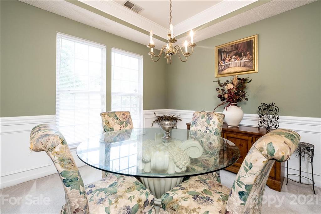 2331 Pimpernel Road Charlotte, NC 28213 - Photo 11 of 30 a view of a dining room with furniture and chandelier