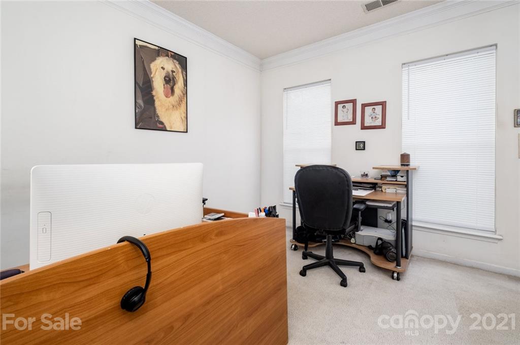 2331 Pimpernel Road Charlotte, NC 28213 - Photo 14 of 30 a view of a workspace with furniture and a window
