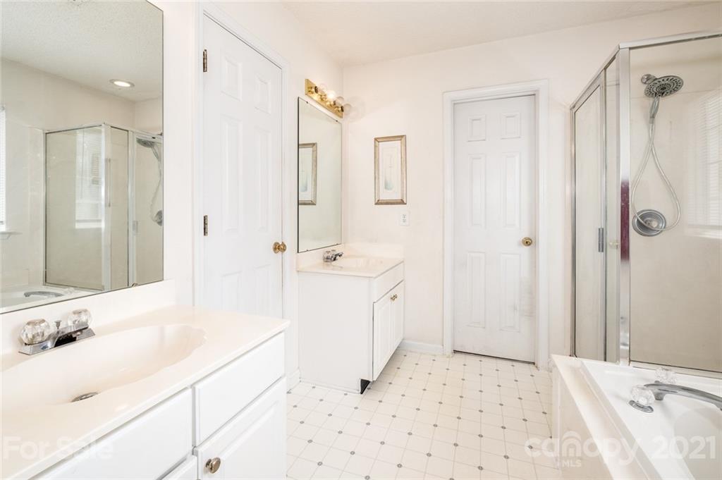 2331 Pimpernel Road Charlotte, NC 28213 - Photo 17 of 30 a bathroom with a sink a toilet and shower