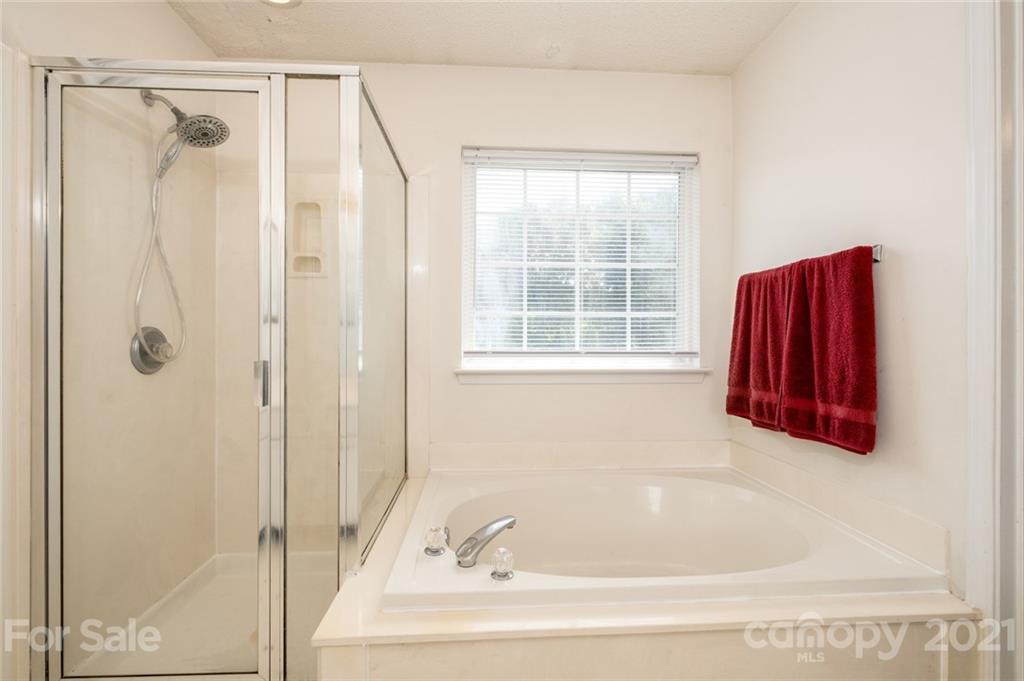 2331 Pimpernel Road Charlotte, NC 28213 - Photo 19 of 30 a bathroom with a tub and shower