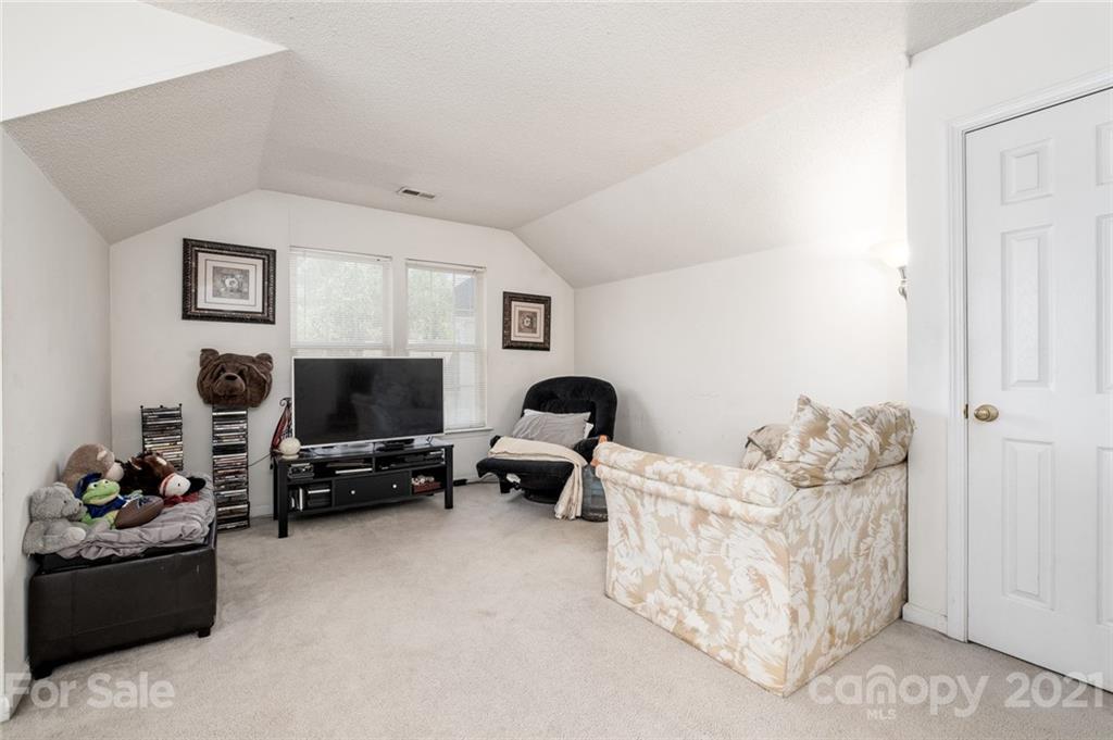 2331 Pimpernel Road Charlotte, NC 28213 - Photo 21 of 30 a living room with furniture and a flat screen tv