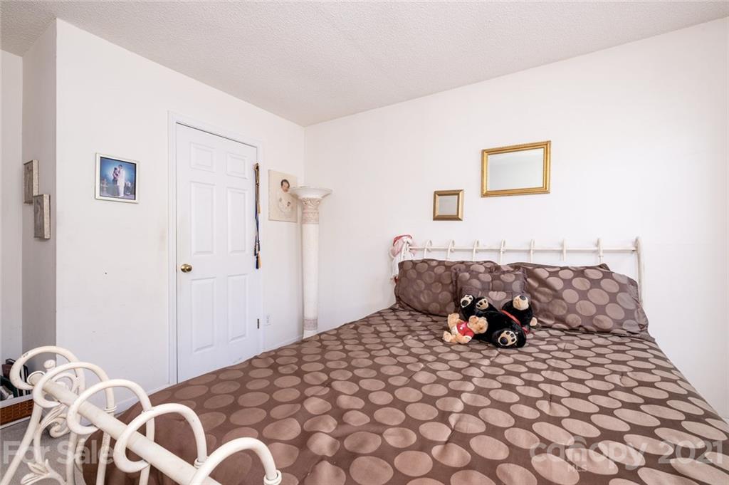 2331 Pimpernel Road Charlotte, NC 28213 - Photo 23 of 30 a bedroom with a bed and window