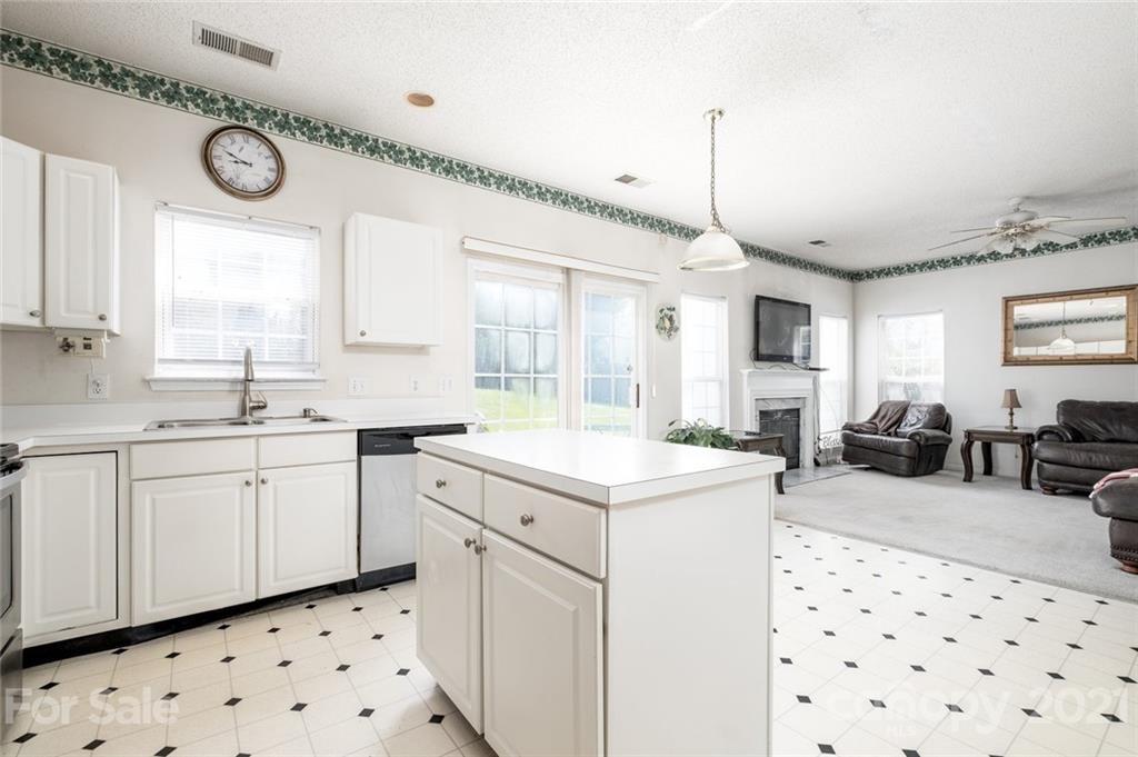 2331 Pimpernel Road Charlotte, NC 28213 - Photo 6 of 30 a kitchen with sink cabinets and window