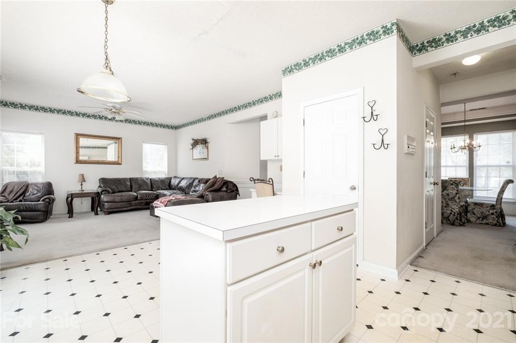 2331 Pimpernel Road Charlotte, NC 28213 - Photo 7 of 30 a view of hallway with furniture and chandelier
