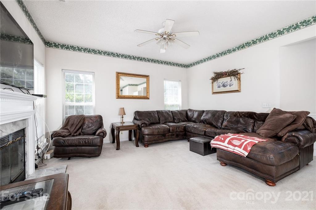 2331 Pimpernel Road Charlotte, NC 28213 - Photo 9 of 30 a living room with furniture and a fireplace