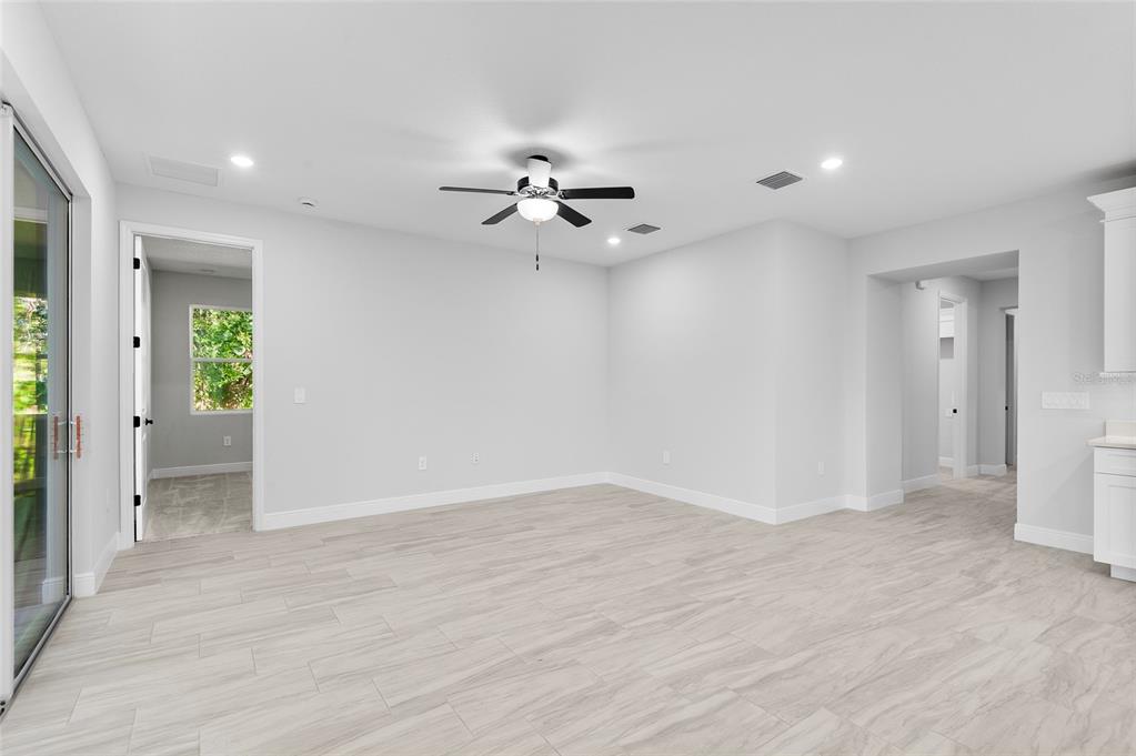371 Miller Road Sanford, FL 32773 - Photo 15 of 50 wooden floor in an empty room with a window