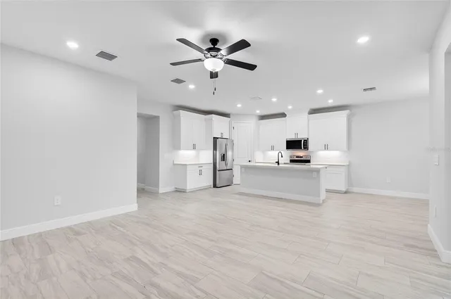 a view of kitchen with wooden floor and window