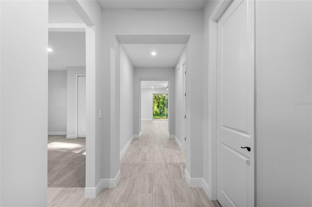 371 Miller Road Sanford, FL 32773 - Photo 37 of 50 a view of a hallway with wooden floor