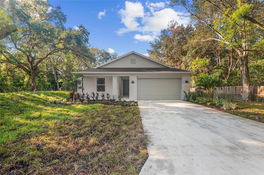 371 Miller Road Sanford, FL 32773 - Photo 40 of 50 a front view of a house with a garden