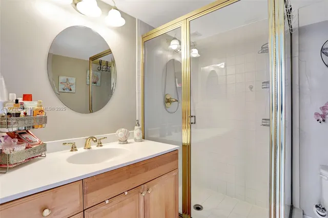 a bathroom with a double vanity sink mirror and a mirror