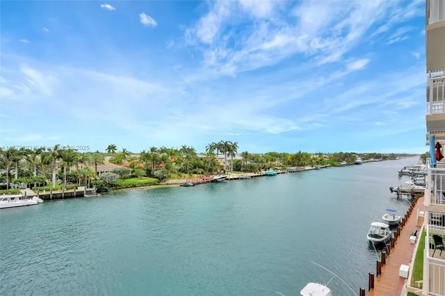 a view of a lake with houses in the back