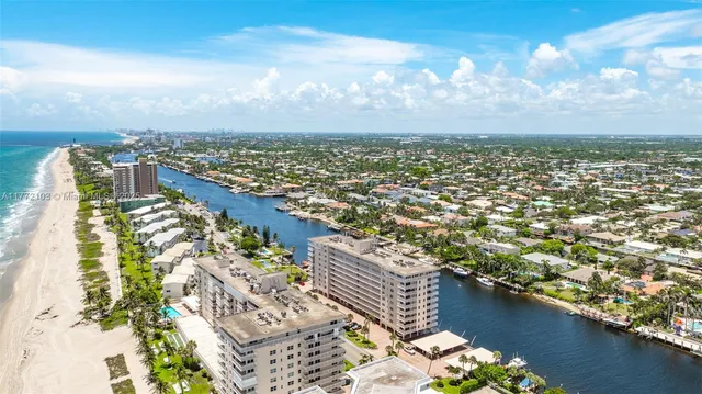 an aerial view of residential building with ocean view