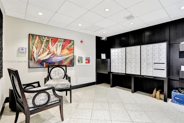 a room with table chairs and window