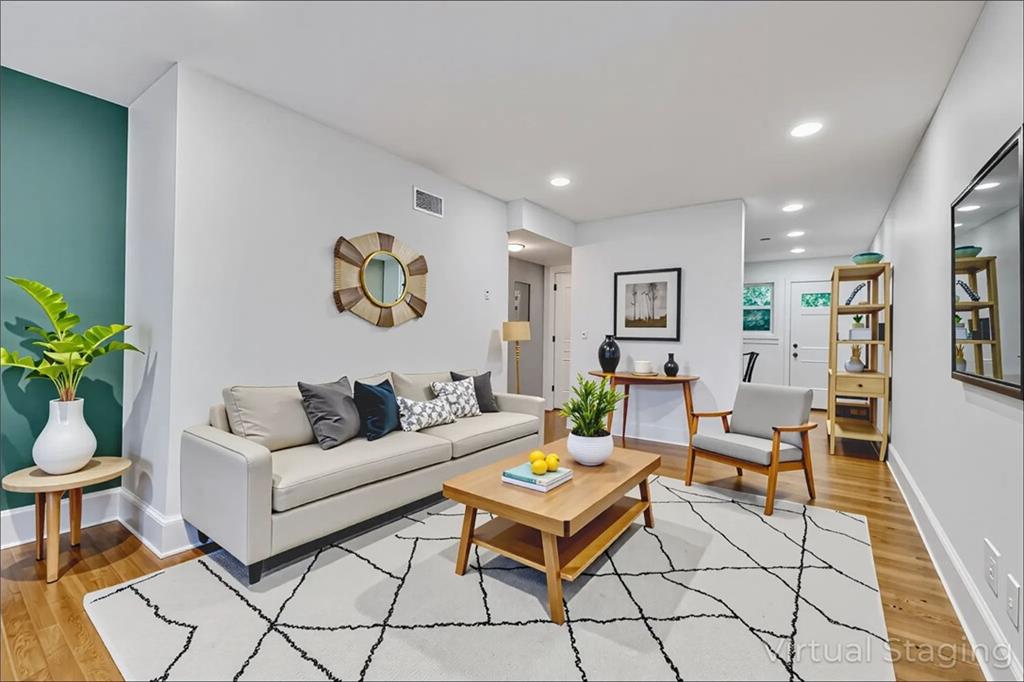 351 Cherokee Avenue Southeast, Unit 6 Atlanta, GA 30312 - Photo 1 of 11 a living room with furniture and wooden floor