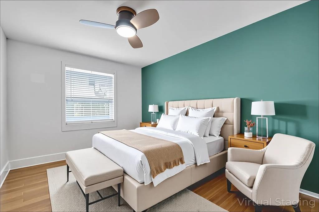 351 Cherokee Avenue Southeast, Unit 6 Atlanta, GA 30312 - Photo 3 of 11 a bedroom with a bed chairs and fan