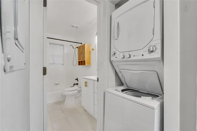 a bathroom with a toilet and a mirror