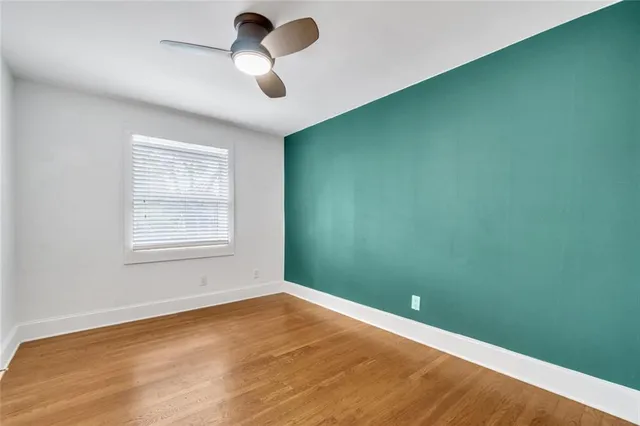 an empty room with a empty space and windows