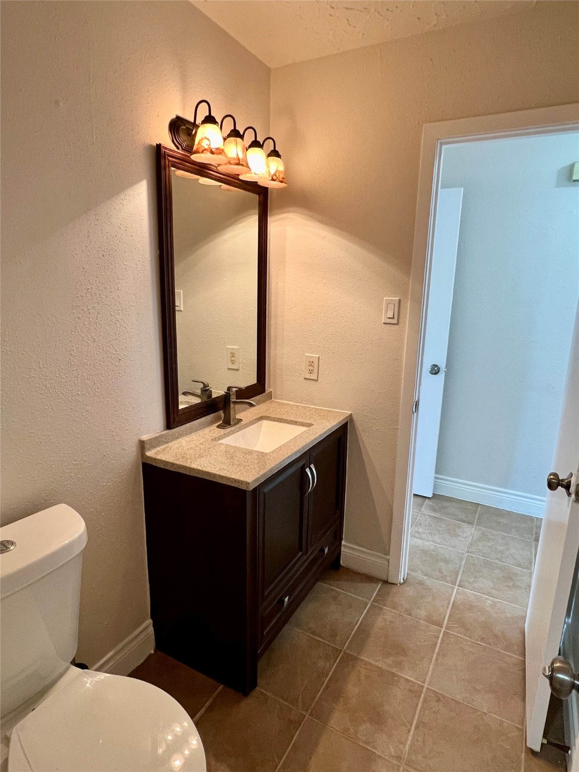 12110 Murr Way Houston, TX 77048 - Photo 14 of 24 a bathroom with a sink and mirror