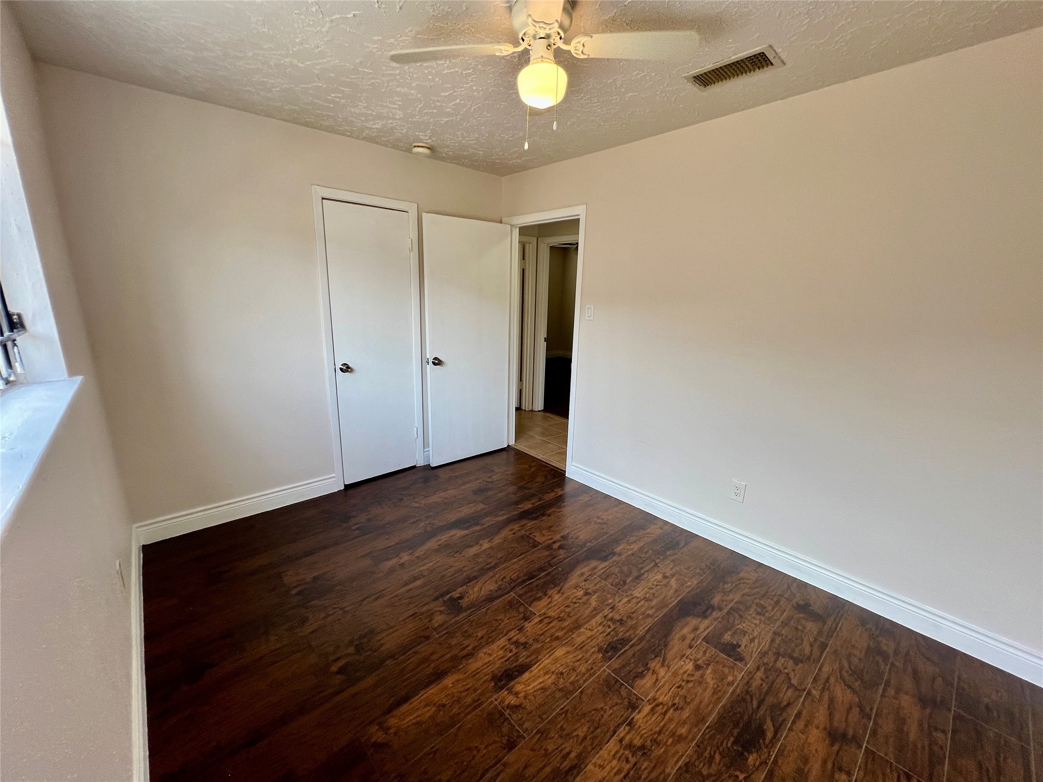 12110 Murr Way Houston, TX 77048 - Photo 21 of 24 wooden floor in an empty room