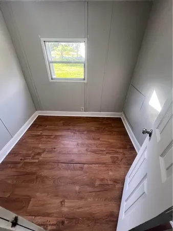 a view of an empty room with a window