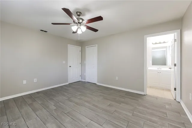 a view of an empty room and wooden floor