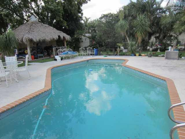 5675 Southwest 111th Terrace Davie, FL 33328 - Photo 9 of 16 a view of a swimming pool with a patio
