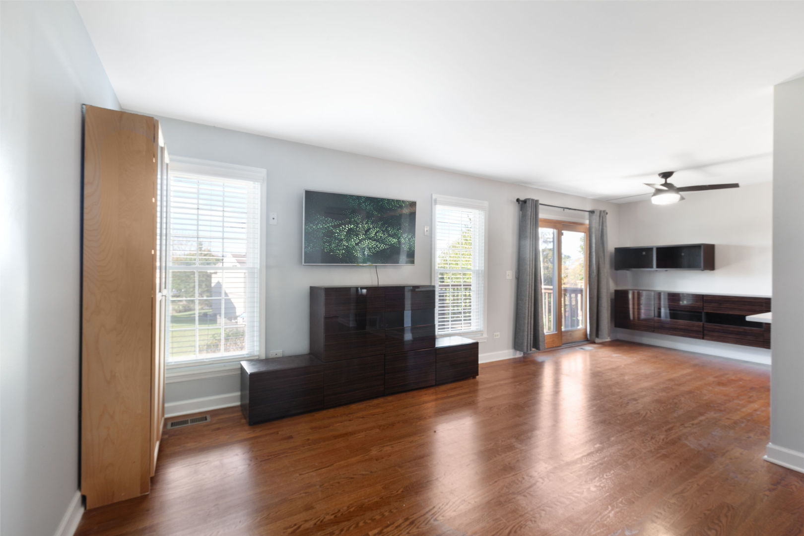 1049 Horizon Ridge Lake In The Hills, IL 60156 - Photo 3 of 25 a view of a big room with wooden floor and windows