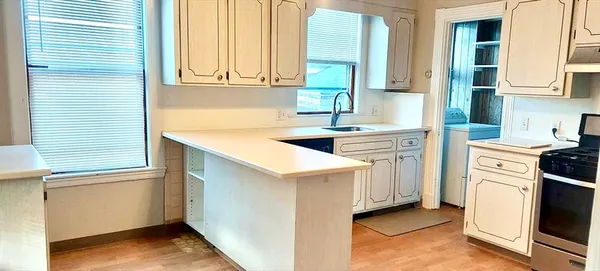 a kitchen that has a cabinets and a stove