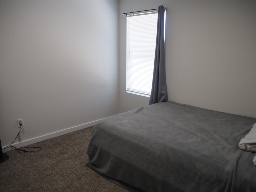 1220 Elva Warren Street Fort Worth, TX 76115 - Photo 15 of 23 a room that has a window in it