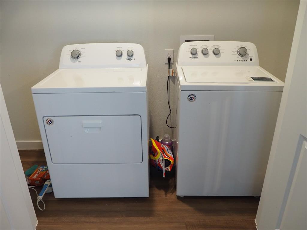 1220 Elva Warren Street Fort Worth, TX 76115 - Photo 21 of 23 a utility room with dryer and washer