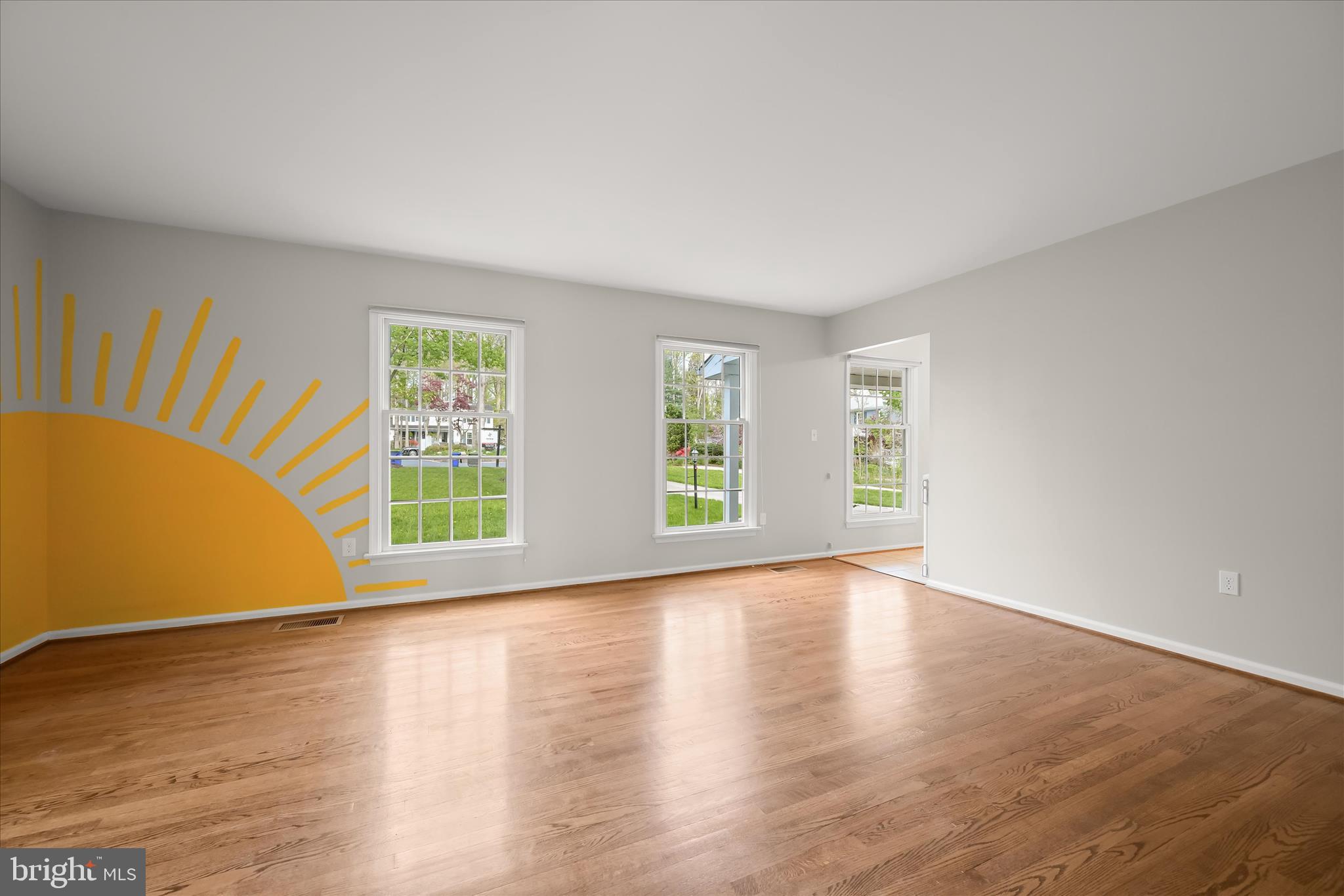 10428 Schoolmaster Place Columbia, MD 21044 - Photo 13 of 69 a view of an empty room with wooden floor and a window