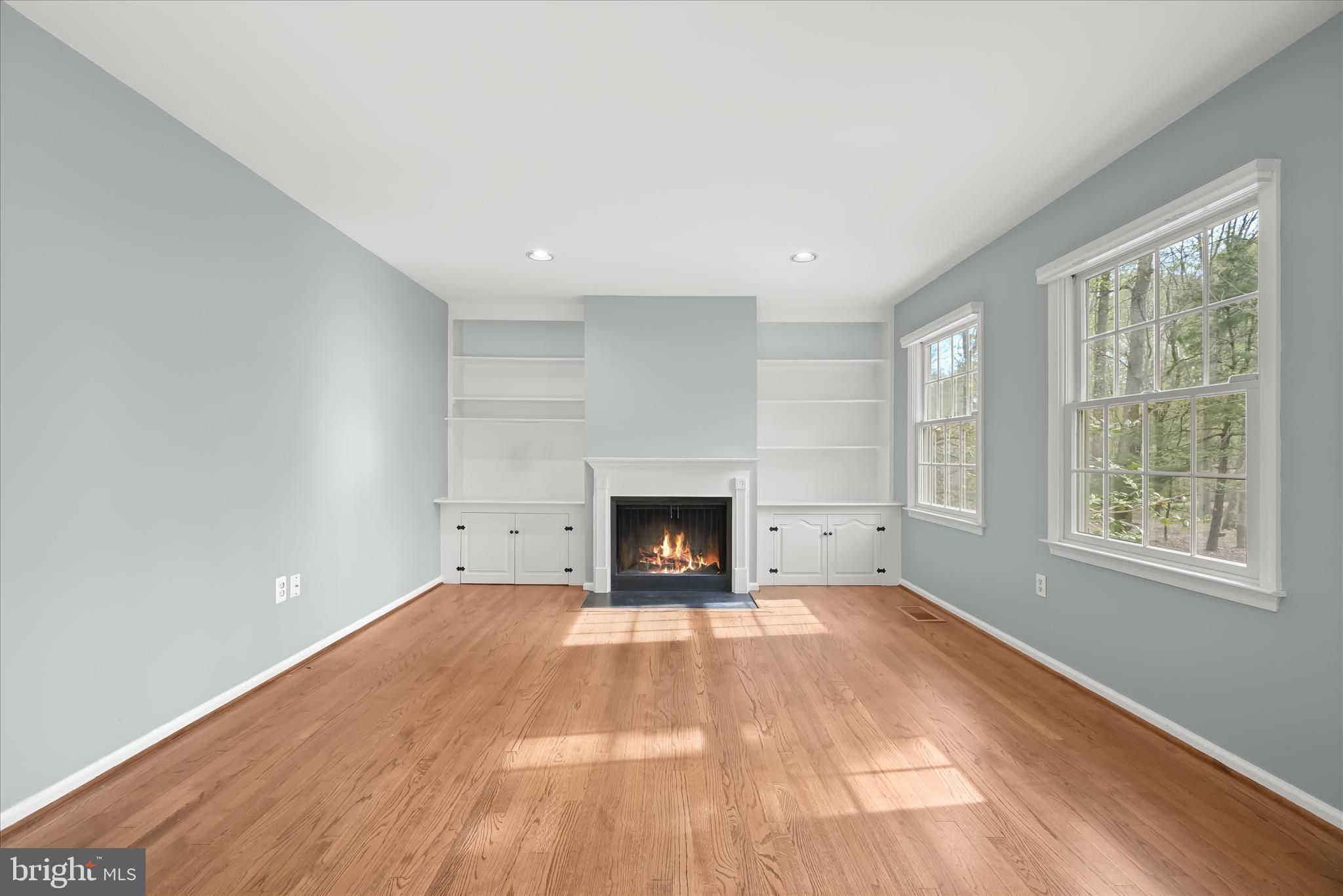 10428 Schoolmaster Place Columbia, MD 21044 - Photo 18 of 69 a view of an empty room with a window and a fireplace