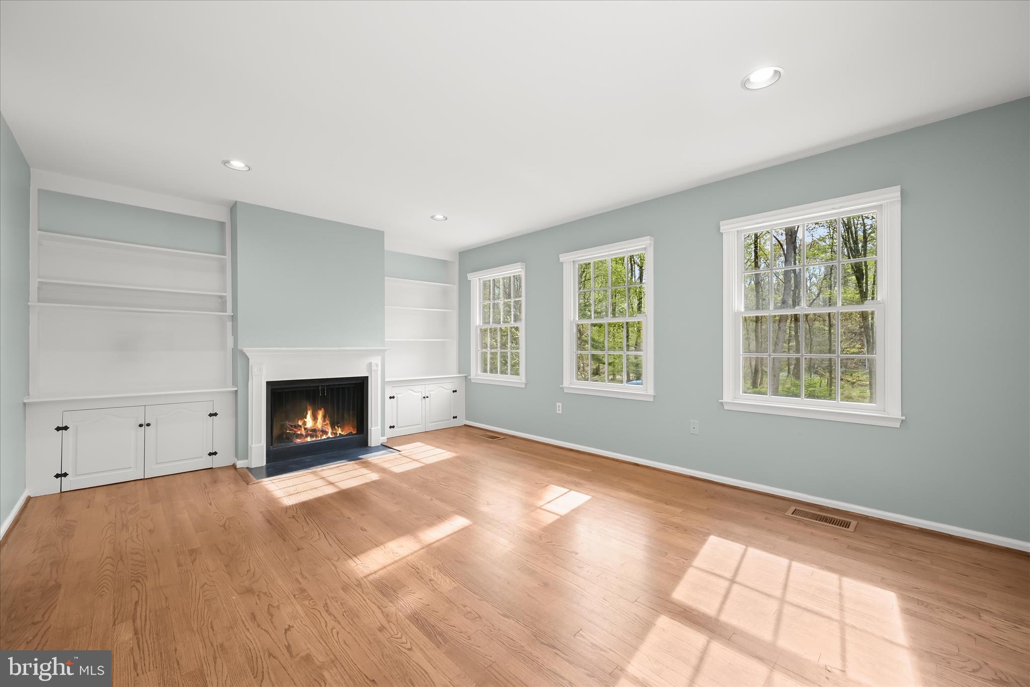 10428 Schoolmaster Place Columbia, MD 21044 - Photo 19 of 69 an empty room with windows and fireplace