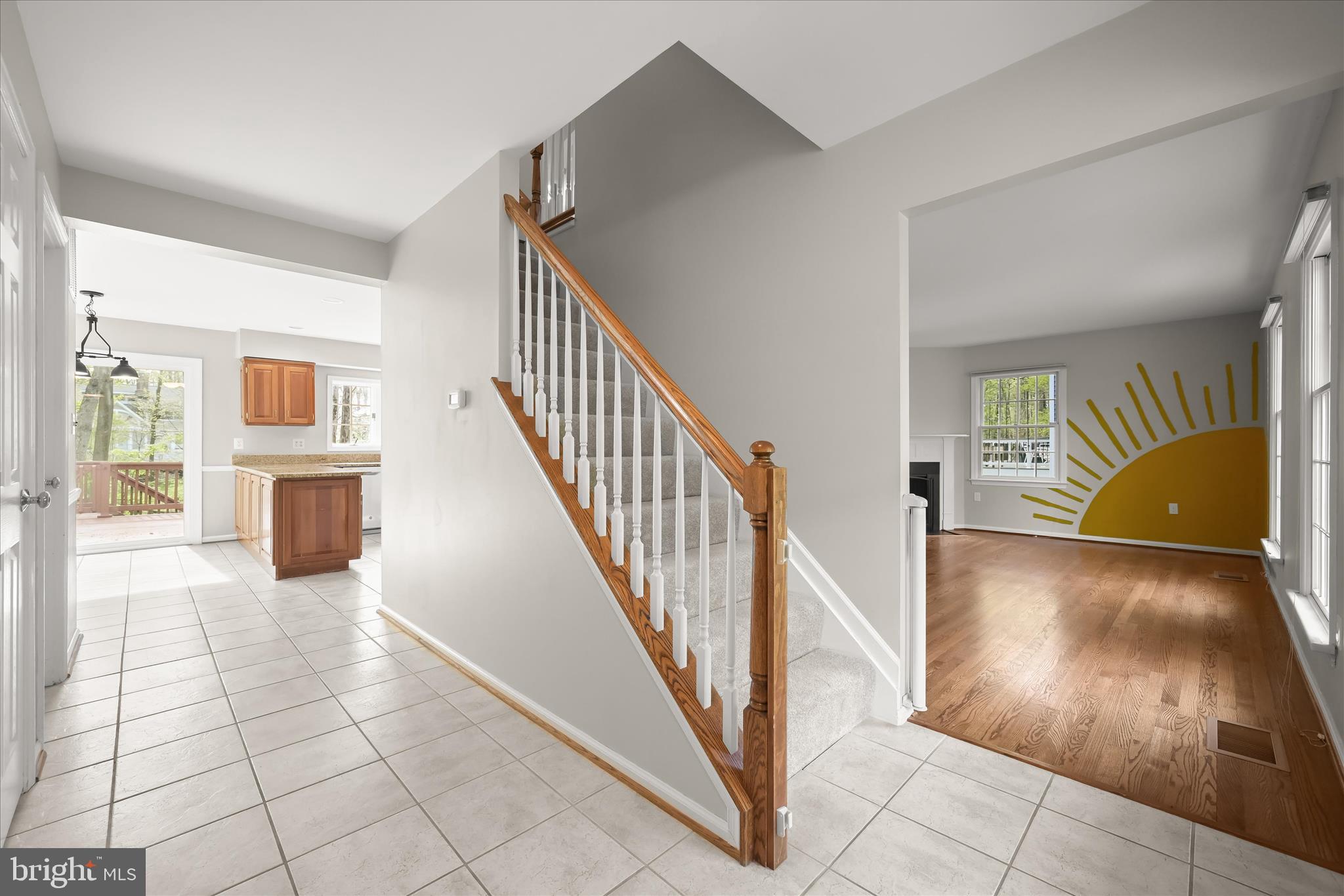 10428 Schoolmaster Place Columbia, MD 21044 - Photo 30 of 69 a view of a livingroom with wooden floor and staircase