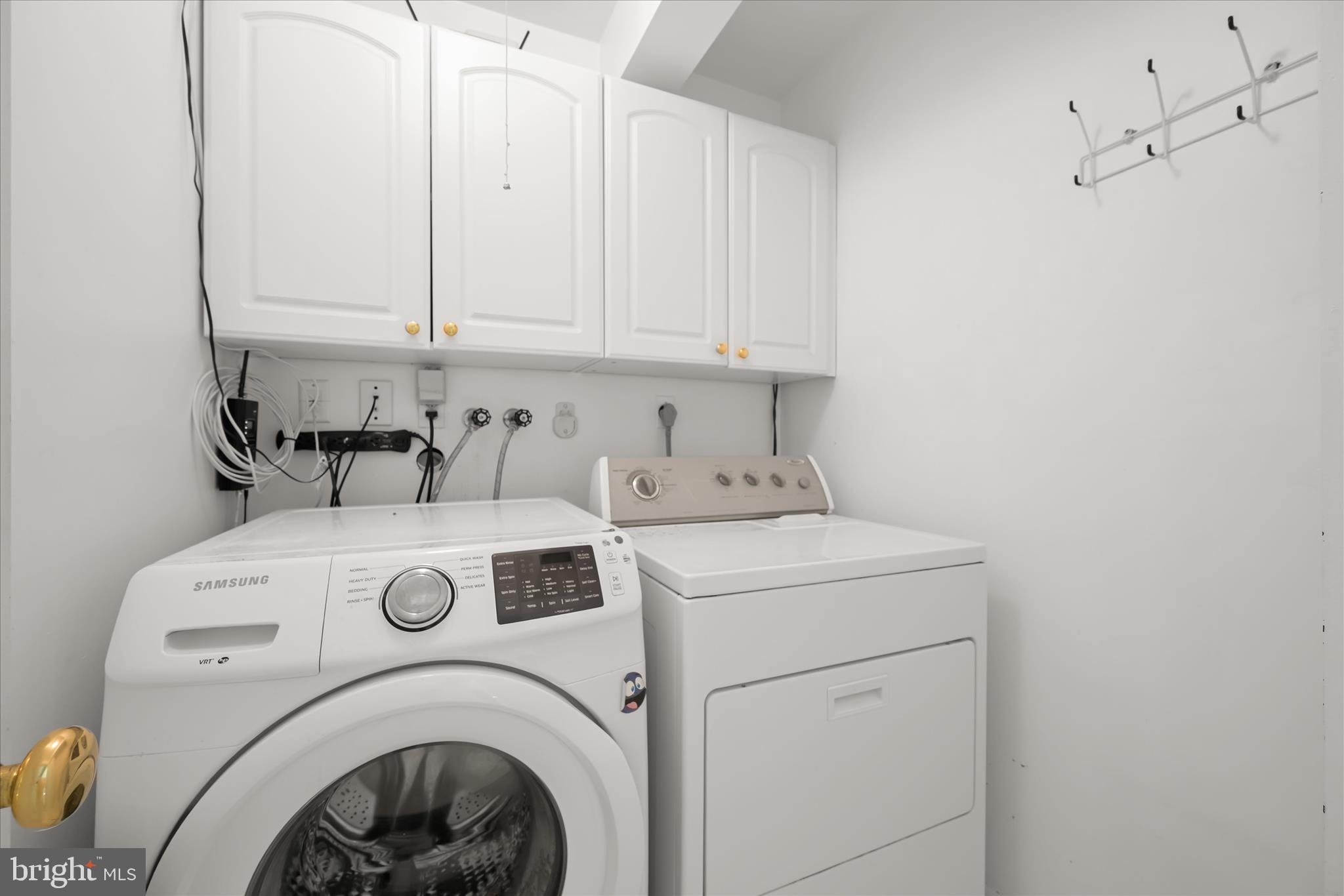 10428 Schoolmaster Place Columbia, MD 21044 - Photo 32 of 69 a utility room with dryer and washer