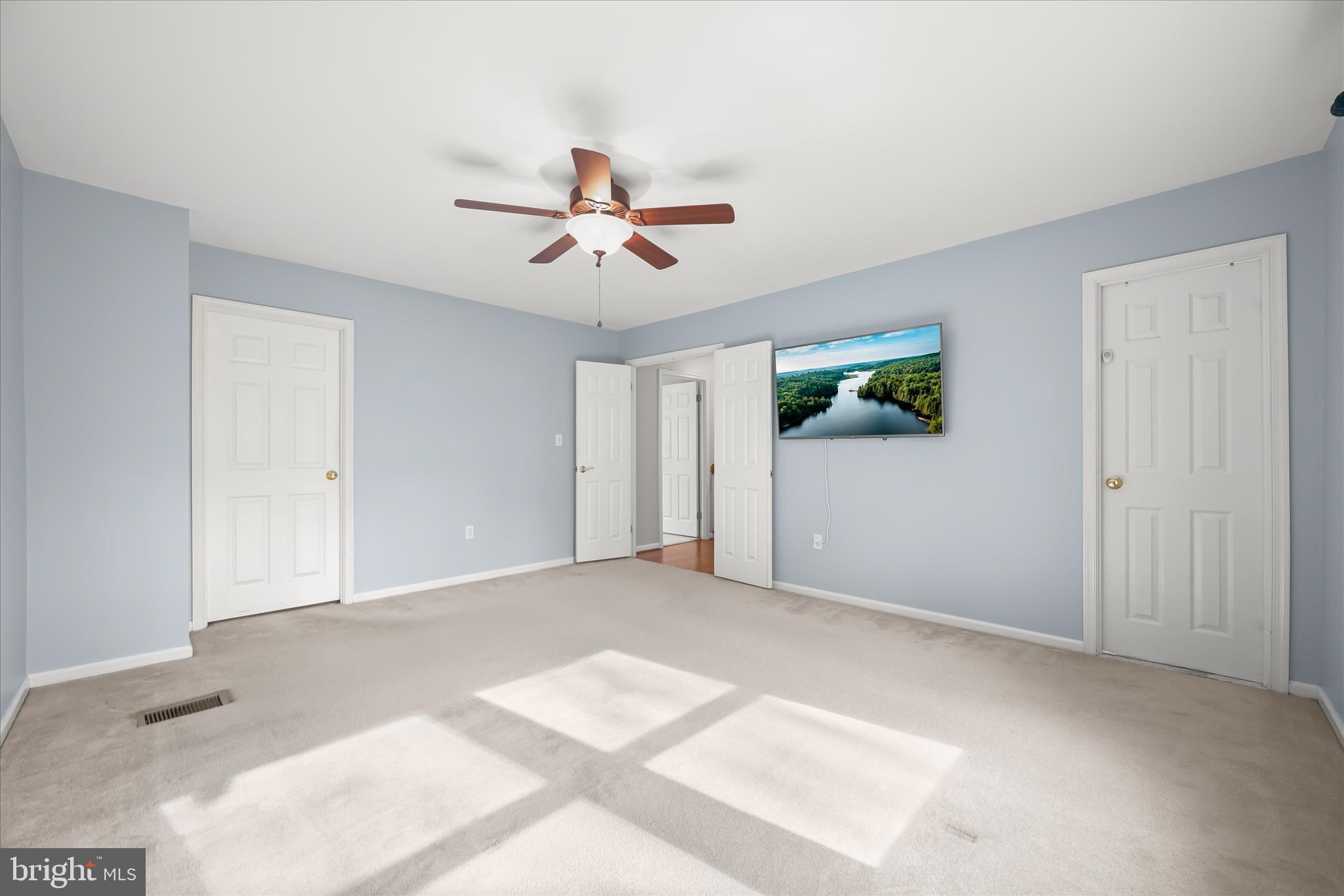 10428 Schoolmaster Place Columbia, MD 21044 - Photo 35 of 69 a view of room with a ceiling fan and hardwood floor